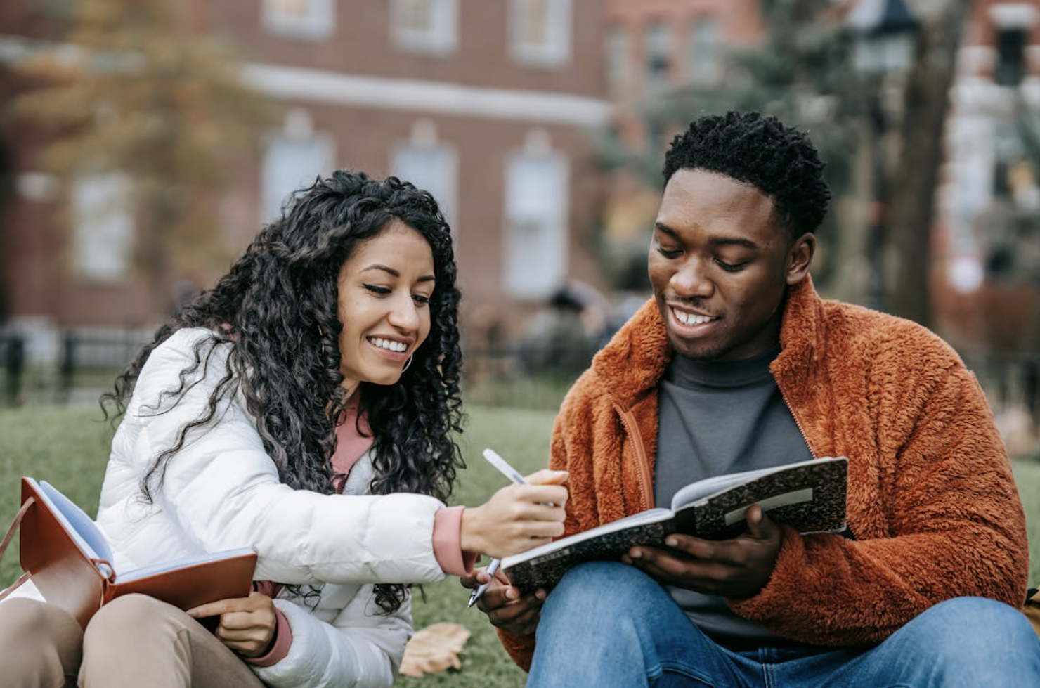 Two students studying outside.