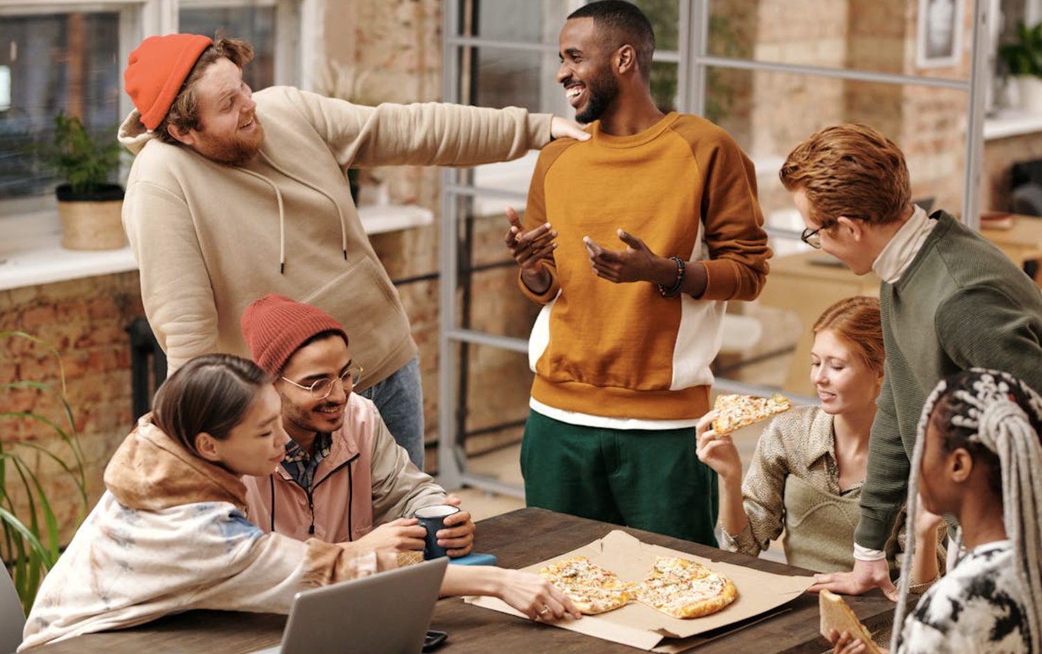 A group of people eating food. 