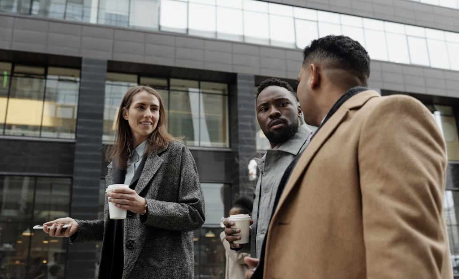 People walking next to each other before heading to work.